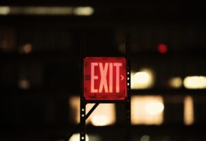 red exit sign scaled 1